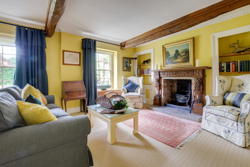 Colourful Sitting room with comfortable seating and character features
