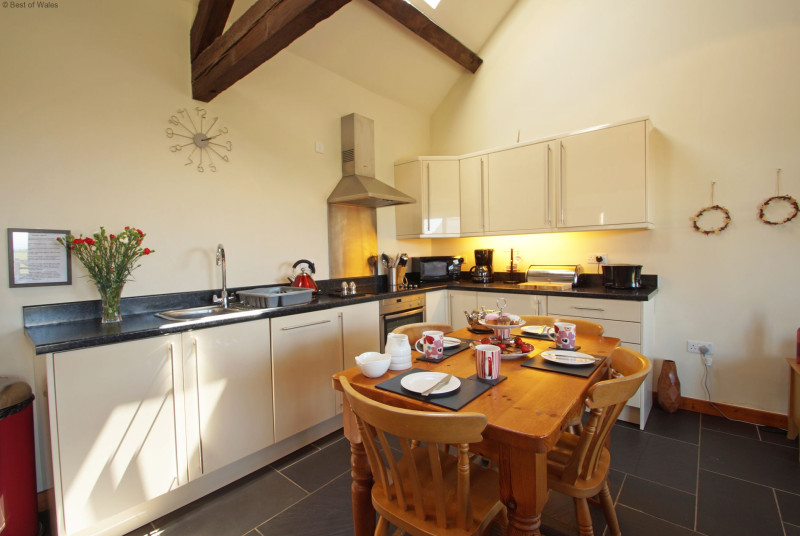 Open plan living area - spacious double height room with beams