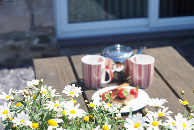 The patio is perfectly located to capture the sea & countryside views