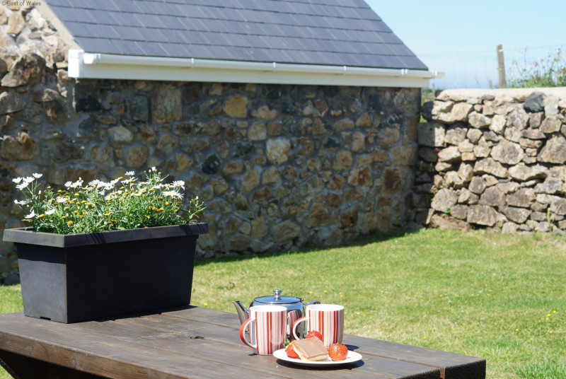 The patio is perfectly located to capture the sea & countryside views