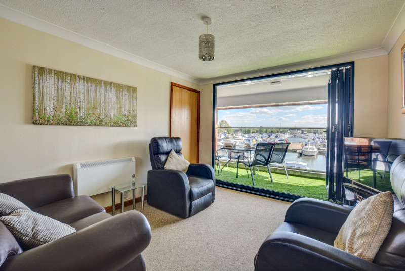 Sitting Area with bifold doors to balcony and marina views