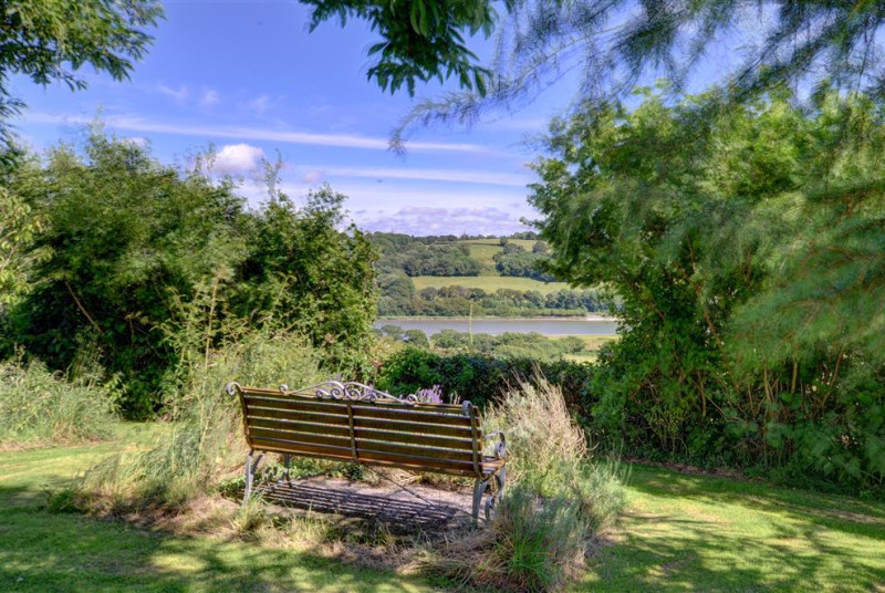 The peacefully located cottage stands in well-maintained grounds overlooking the River Tywi